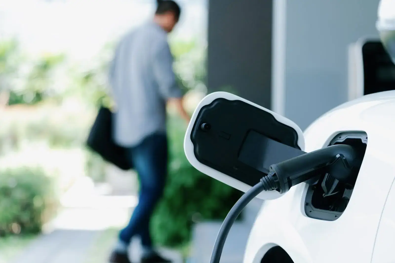 Certified Alta electrician installing a Level 2 EV charger in an Addison IL garage