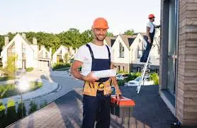 Alta Property Services technician performing HOA community building maintenance in DuPage County