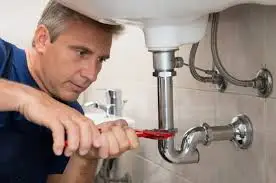 Alta technician inspecting a burst pipe in a Chicago-area home