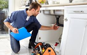 Alta Property Services licensed plumber repairing emergency pipe leak in Palatine Illinois