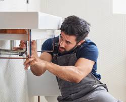 Alta Property Services plumbing technician working on a property in Mount Prospect Illinois