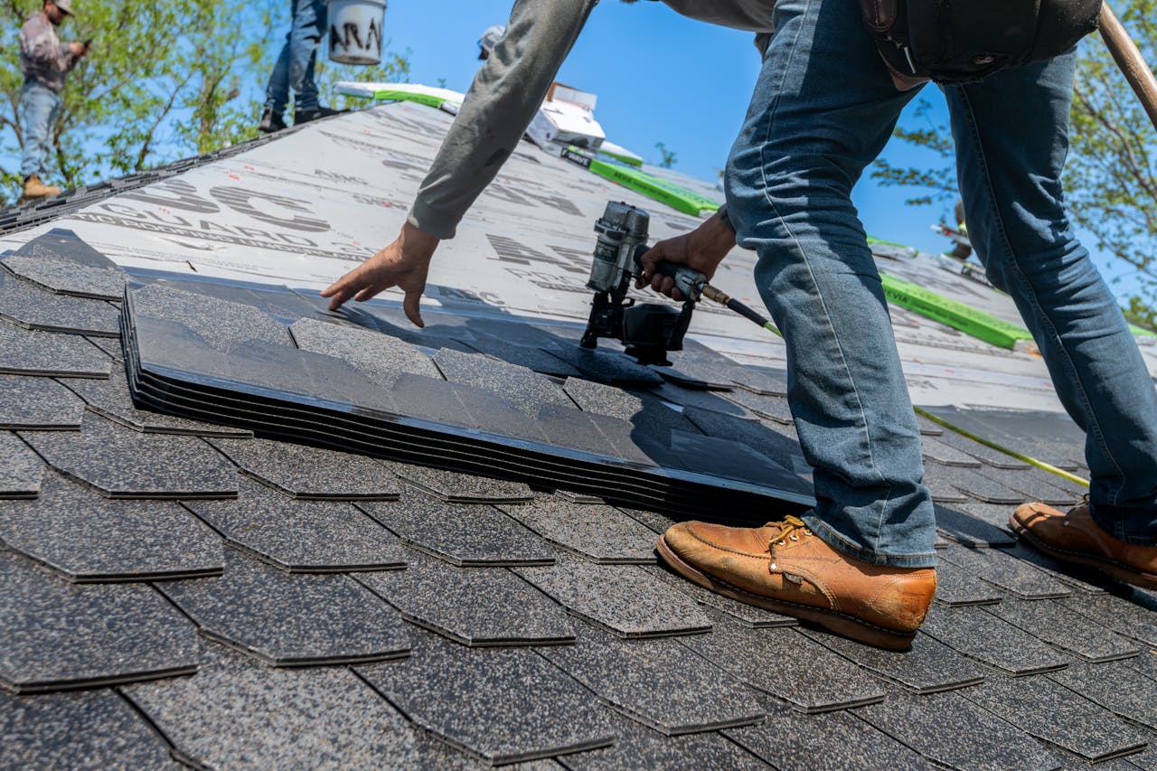 Alta Property Services team installing asphalt shingles on a Chicago-area home